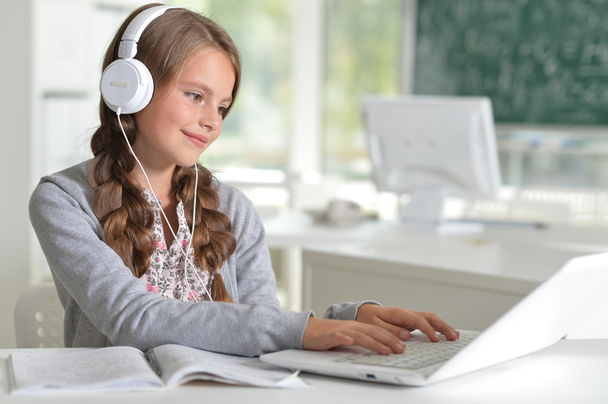 cute girl using laptop computer