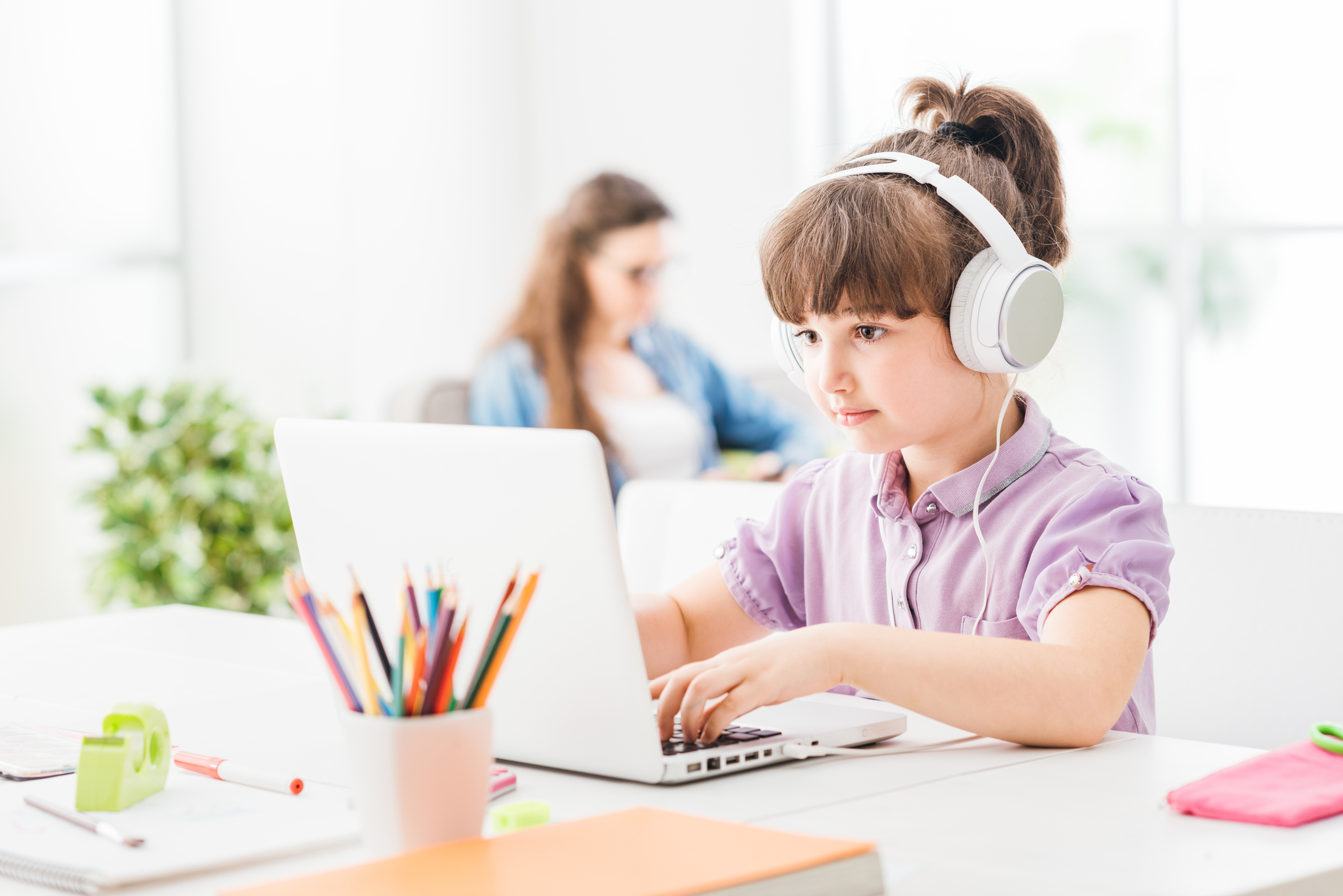 Smart girl connecting with a laptop