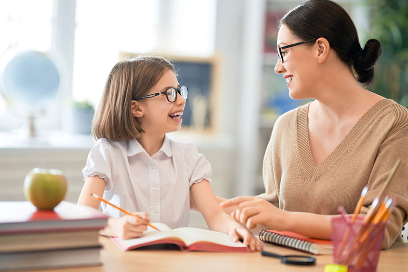 Girl with teacher in classroom